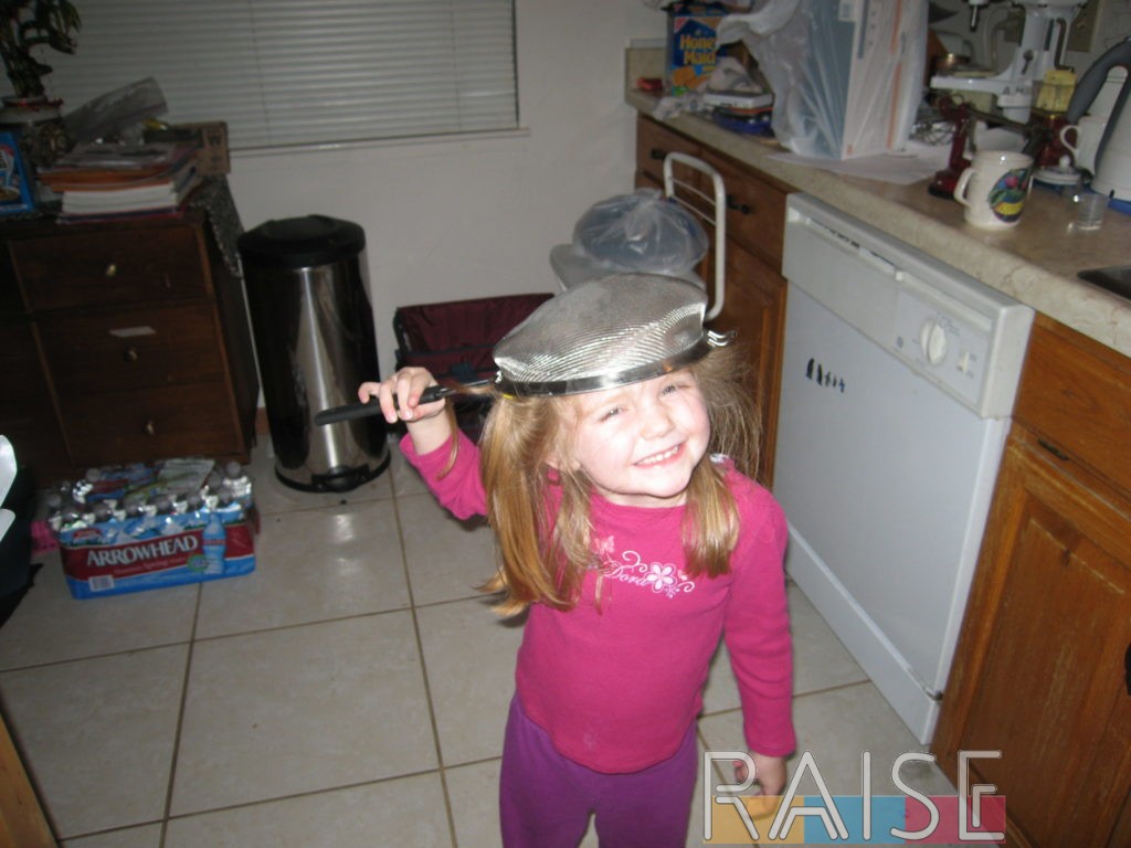 Kid Four Playing with a Sieve by The Allergy Chef